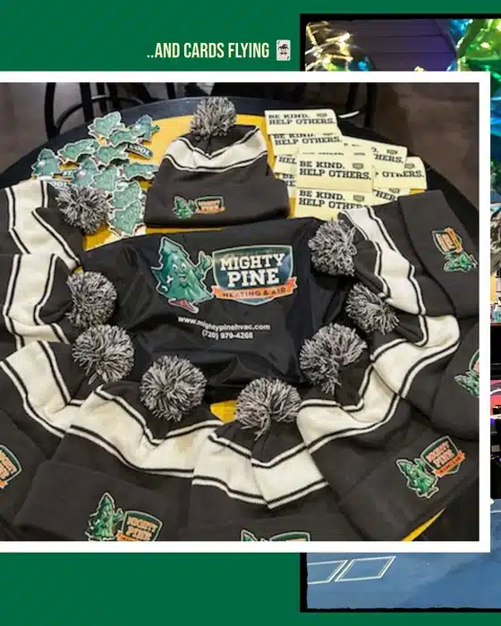 Mighty Pine beanies, blankets, and "Be Kind, Help Others" cards displayed at a Standley Lake Boosters event in CO