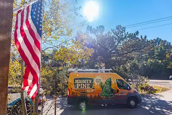 Mighty Pine truck parked at a customer's home in Arvada, CO