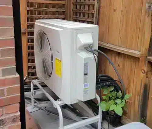 Heat pump outside of residential home in Arvada, CO.