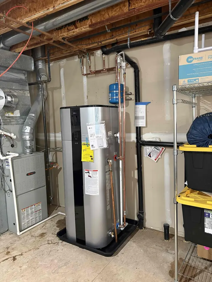 Heat pump water heater installed in a basement by Mighty Pine