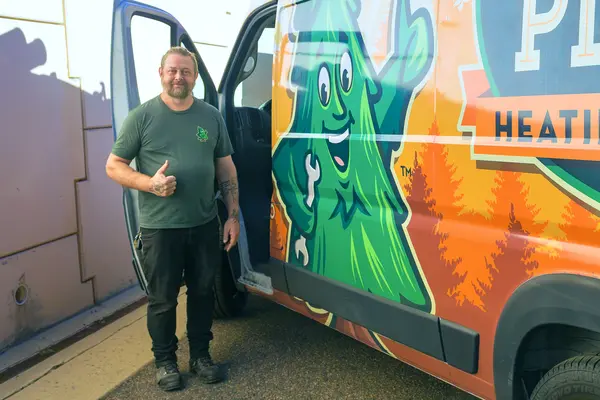 Mighty Pine technician standing beside a Mighty Pine service van in Arvada, CO