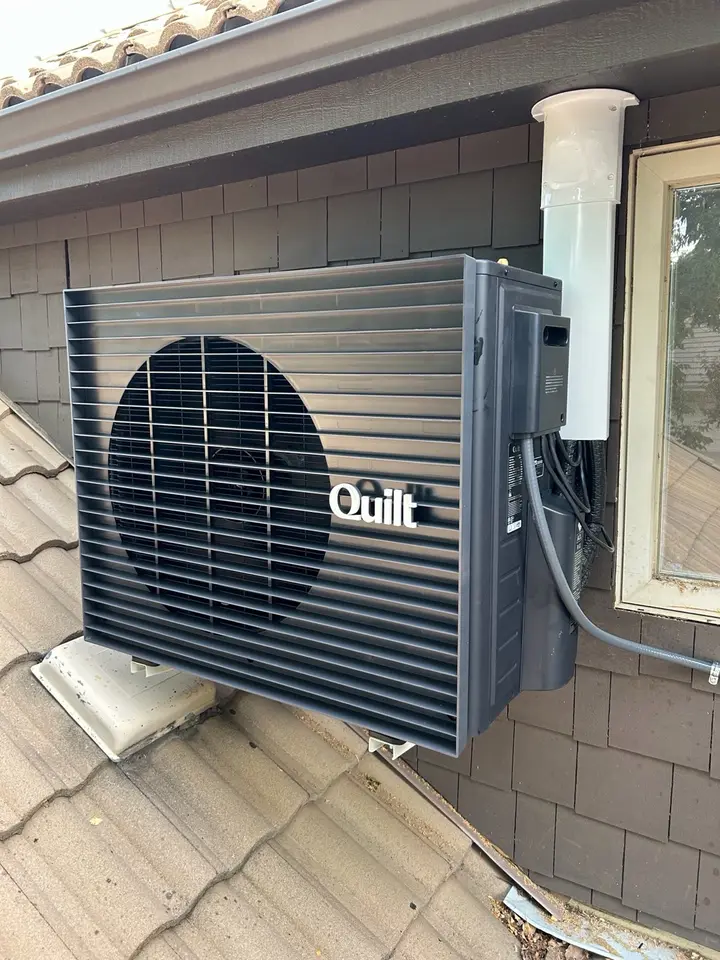 Wall-mounted Quilt heat pump outdoor unit installed by Mighty Pine